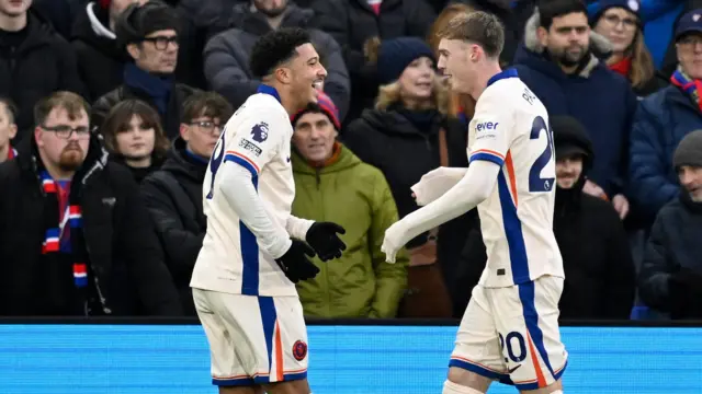 Chelsea's Cole Palmer celebrates scoring their first goal with Jadon Sancho