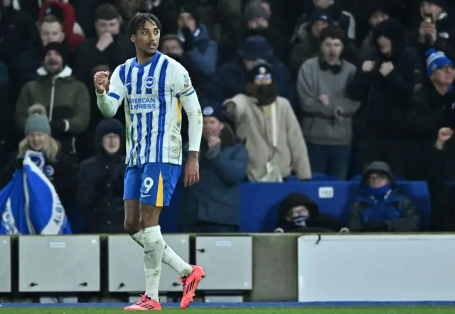 Joao Pedro pumps his fist in celebration