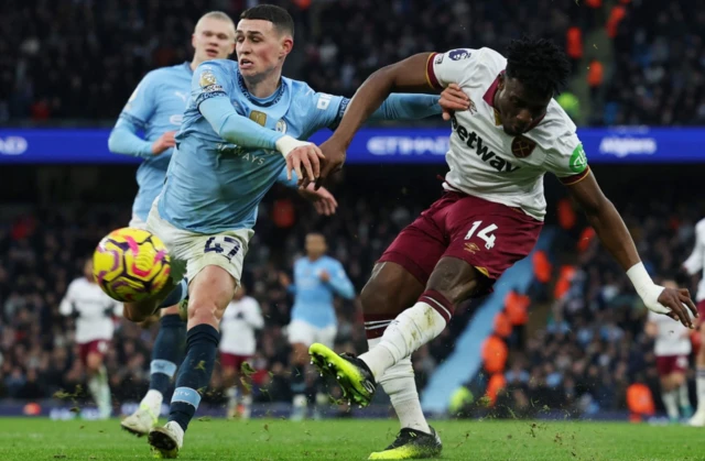 Manchester City's Phil Foden in action with West Ham United's Mohammed Kudus