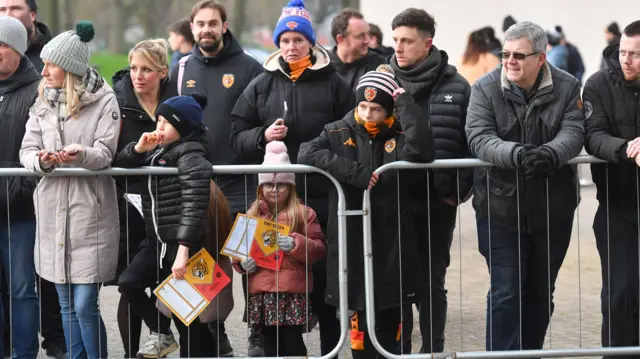 Fans queue for autographs outside the MKM Stadium