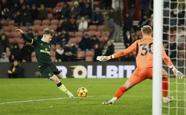 Lewis Potter scores the fourth for Brentford with his left foot