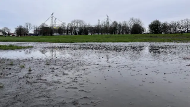 A flooded Moor Park with Deepdale in the background