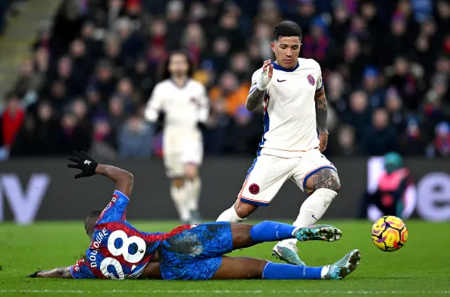 Enzo Fernandez of Chelsea is challenged by Cheick Doucoure