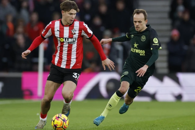 Brentford's Mikkel Damsgaard in action with Southampton's Tyler Dibling