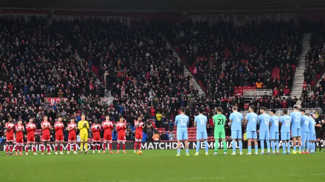 Middlesbrough and Cardiff players observe a minute's silence at the Riverside