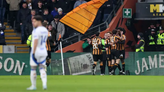 Hull players celebrate with Abu Kamara after his goal against Leeds