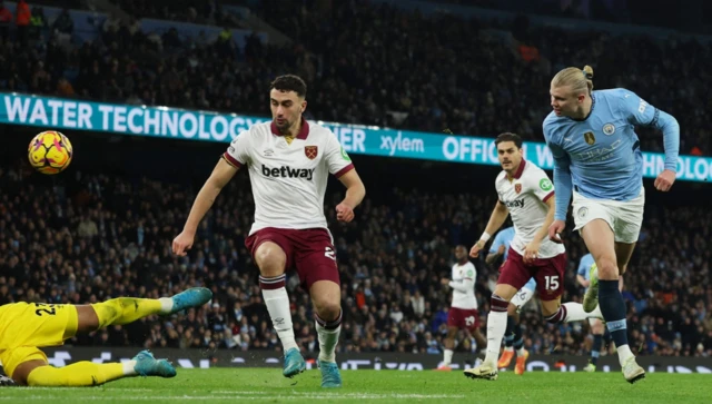 Manchester City's Erling Haaland scores their third goal