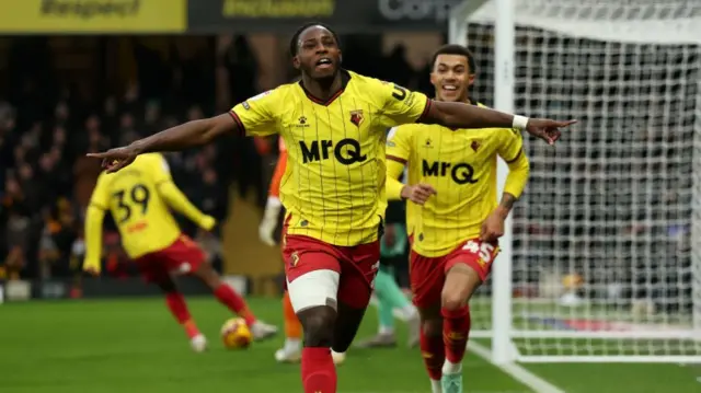 Watford goalscorer Jeremy Ngakia runs off to celebrate