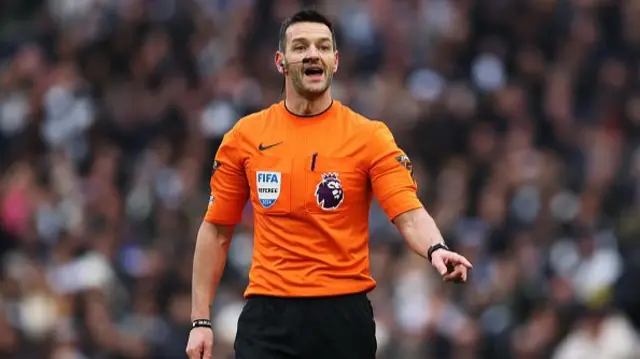 Referee Andy Madley looks on