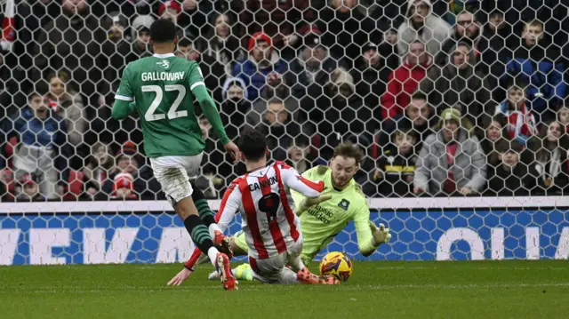 Conor Hazard saves at the feet of Tom Cannon