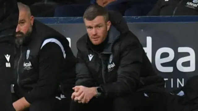 Chris Brunt sat on the West Brom bench