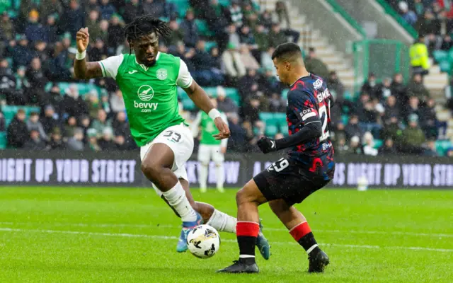 Hibernian's Rocky Bushiri (L) and Rangers' Hamza Igamane in action during a William Hill Premiership match between Hibernian and Rangers at Easter Road