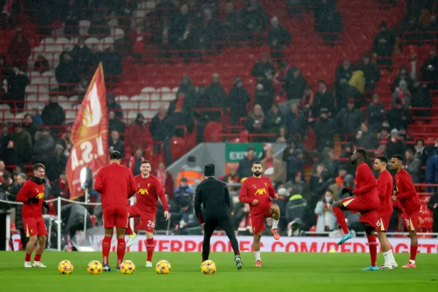 Liverpool players warm up