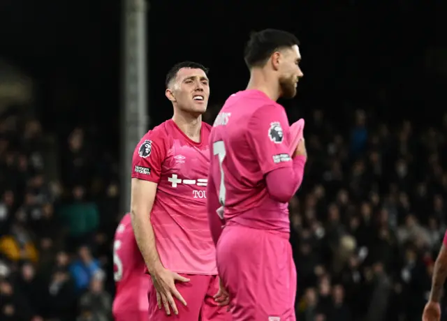 Ipswich players react to a late penalty against them