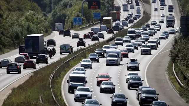 An overhead shot of cars travelling in both directions along the M3