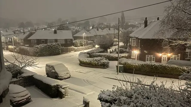 A snow covered residential street