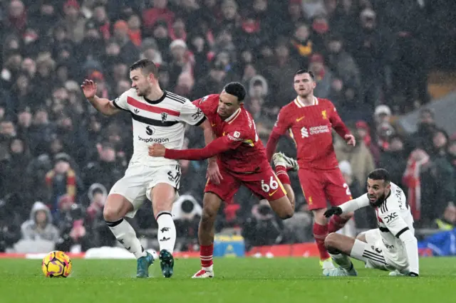 Alexander-Arnold bear hugs De Ligt to try and win the ball back