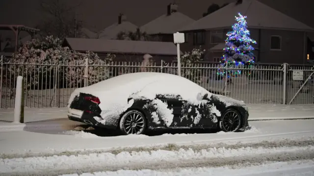 Car in snow in Liverpool