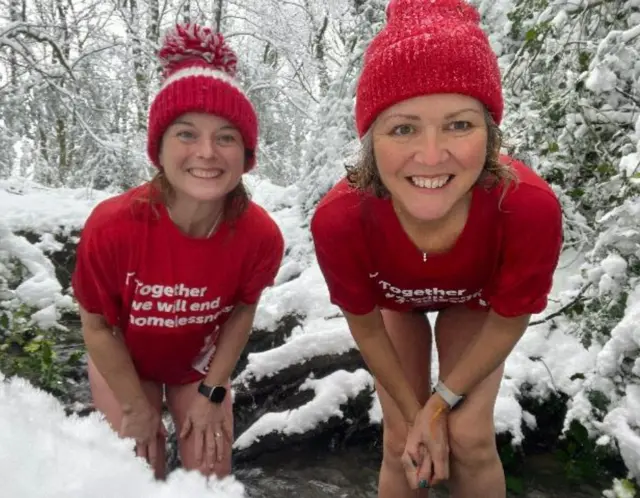 Members of the January Daily Dipper group wearing red t-shirts and red beanie hats