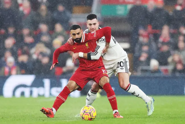 Salah is held by Dalot