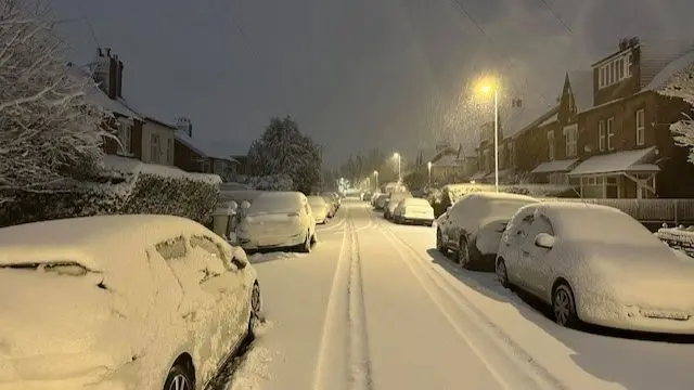 A snow covered residential road