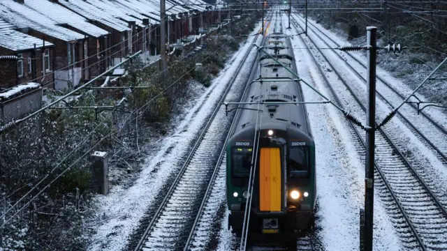 Train on railway line with snow on the ground