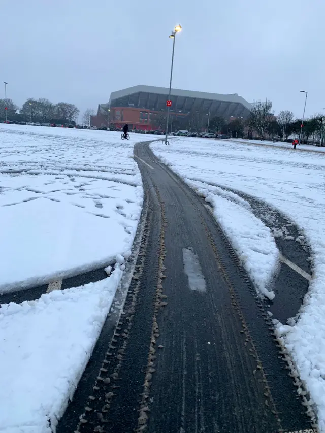 Road up to Anfield covered in snow with tyre tracks