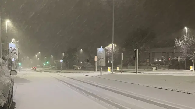 A very snowy main road