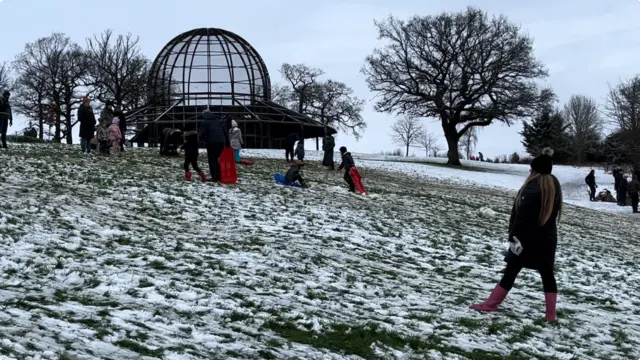 People using sledges at Preston Park in Stockton