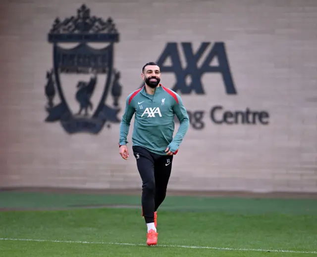 Mo Salah runs out to warm up for training