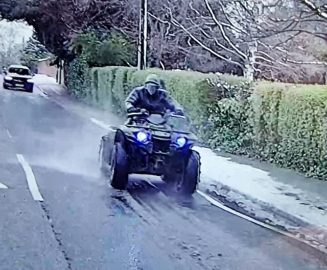 Police are searching for a man in dark clothing who was seen riding a large quad bike