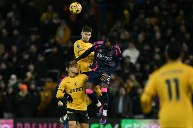 Wolves and Forest players battle for the ball