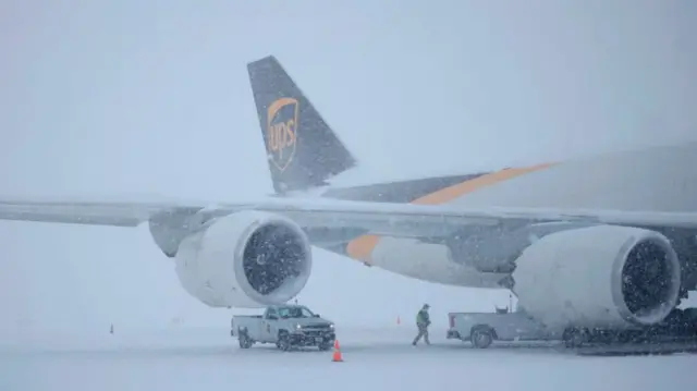 A plane pictured during a snowstorm