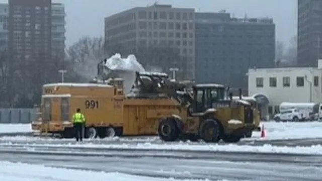 A snowplow collects snow