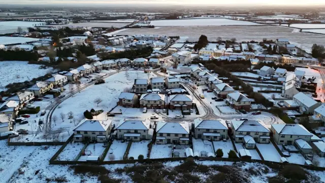 Several houses surrounded in snow in village of Ballylynan in County Laois in Ireland.