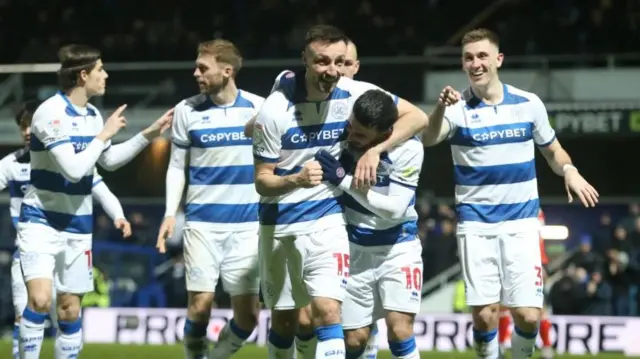 QPR players celebrate with Morgan Fox