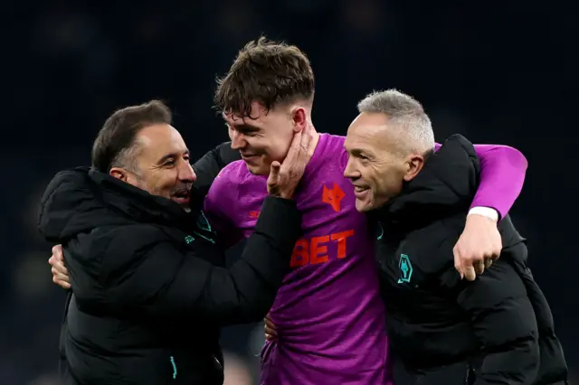 Vitor Pereira, Manager of Wolves, and Andre Monteiro, Assistant Manager, embrace Joergen Strand Larsen