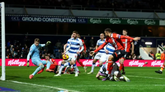 Luton striker Carlton Morris is denied by QPR keeper Paul Nardi