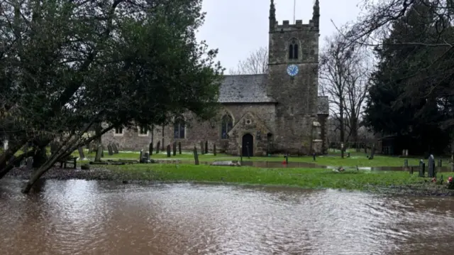 Flood water outside Swithland church in Leicestershire