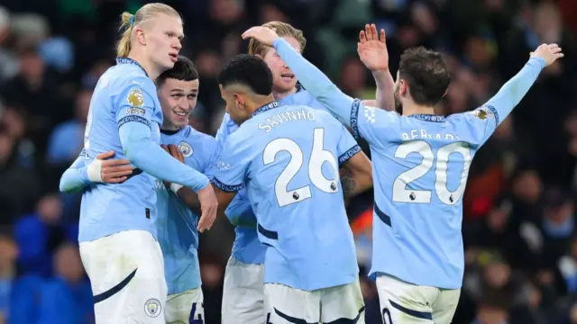 Phil Foden of Manchester City celebrates after scoring their side's fourth goal