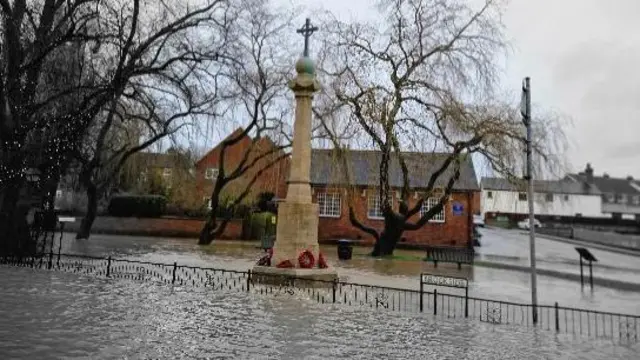 Flooding around a war memorial