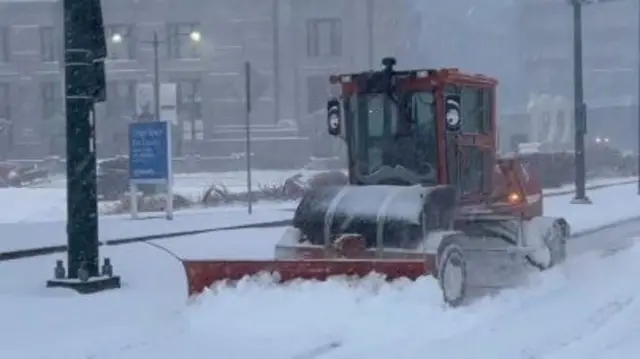 A snowplough clears snow from a road in Kansas City, Missouri. Photo: 5 January 2025