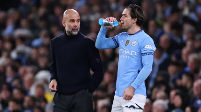 Pep Guardiola manager of Manchester City and Jack Grealish