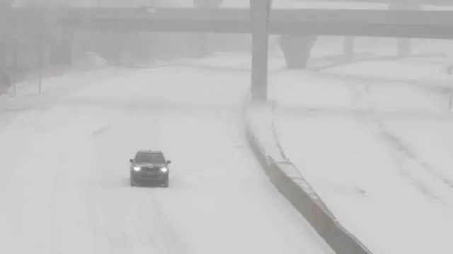 A car seen on snowy road in Kansas