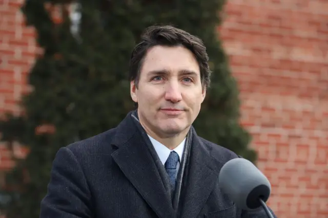 Justin Trudeau speaking to reporters in front of his Rideau Cottage residence