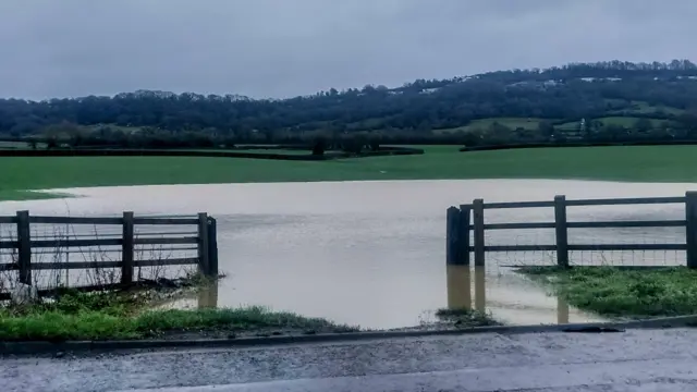 Floodwater in Brookthorpe, Gloucestershire