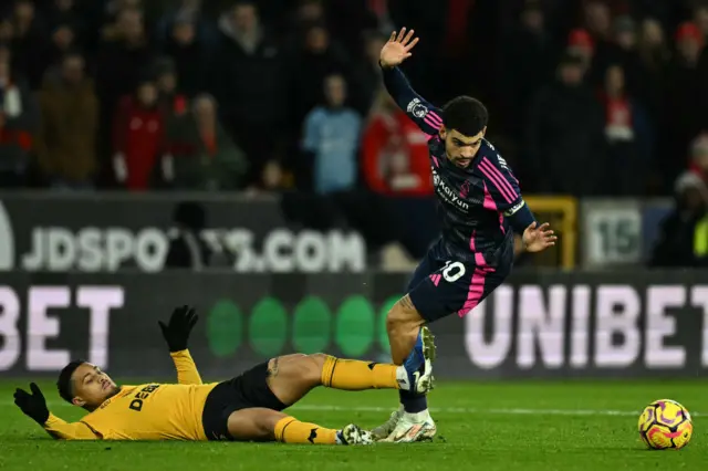 Joao Gomes battles with Gibbs-White