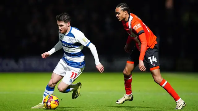 QPR's Paul Smyth takes on Luton Town's Tahith Chong