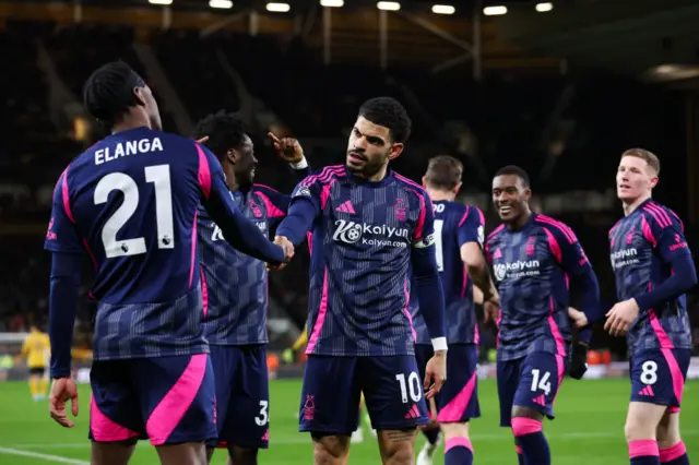 Forest players celebrate after Gibbs-White scores against Wolves