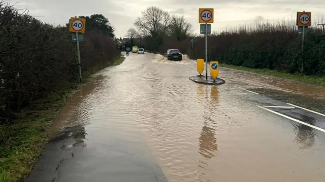 A flooded road at the entrance to Ratby village